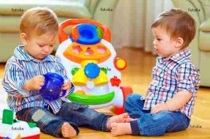 funny baby toddlers playing toys at home